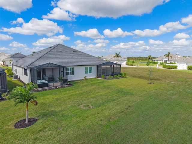 rear view of house featuring a patio, glass enclosure, cooling unit, and a lawn