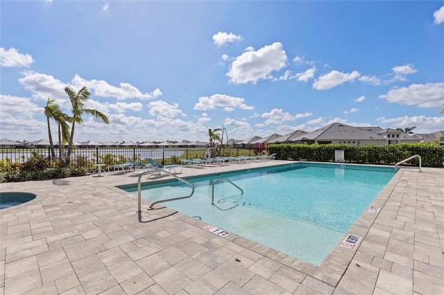 view of swimming pool with a patio area