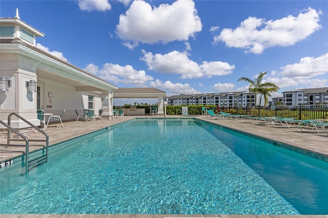 view of swimming pool featuring a patio area