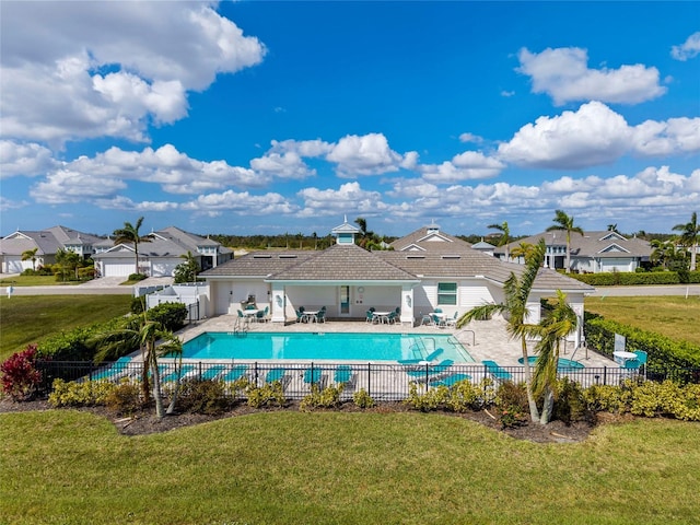 view of pool with a yard and a patio area