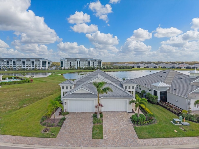 birds eye view of property featuring a water view