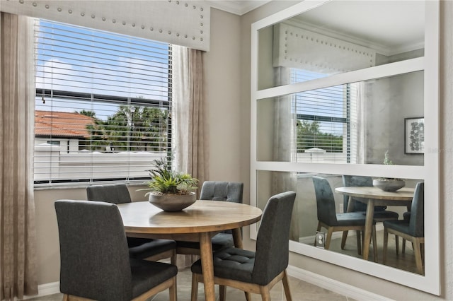 dining room featuring crown molding