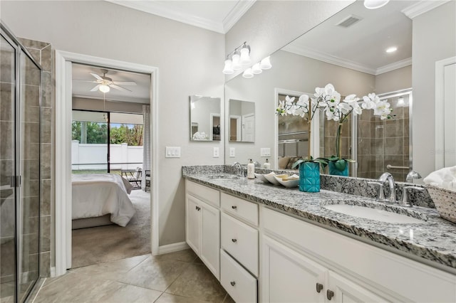 bathroom featuring tile patterned flooring, vanity, ceiling fan, and crown molding