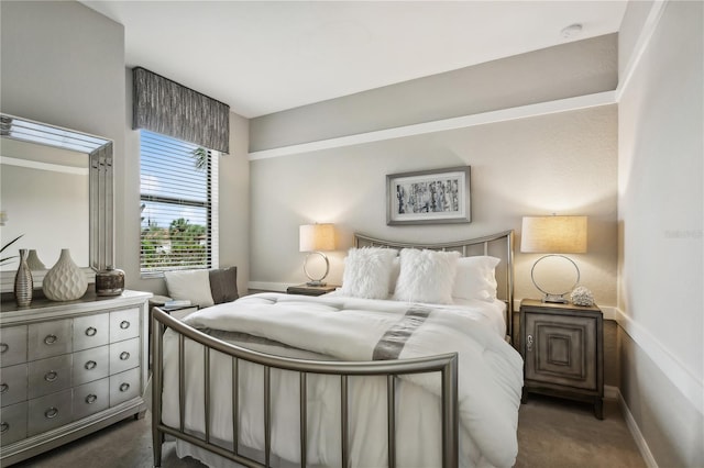 bedroom featuring dark colored carpet