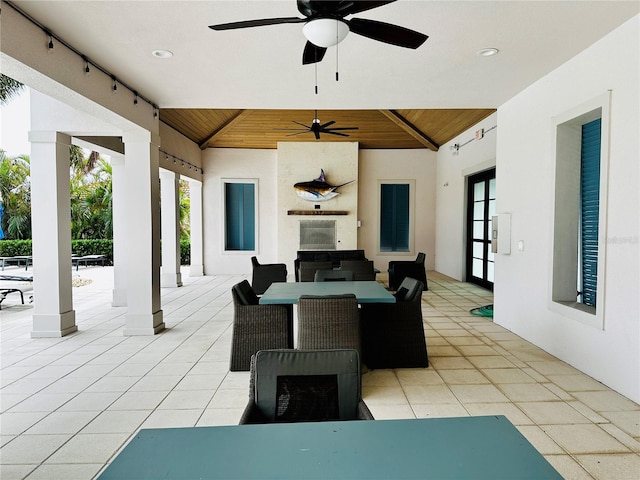 view of patio / terrace featuring ceiling fan and french doors