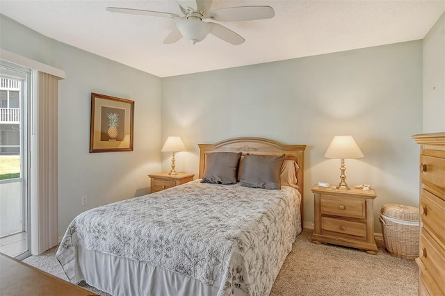 carpeted bedroom featuring multiple windows and ceiling fan