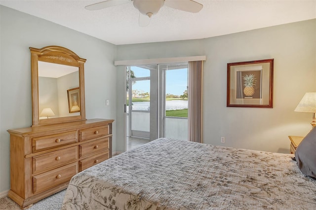 carpeted bedroom featuring ceiling fan and access to exterior