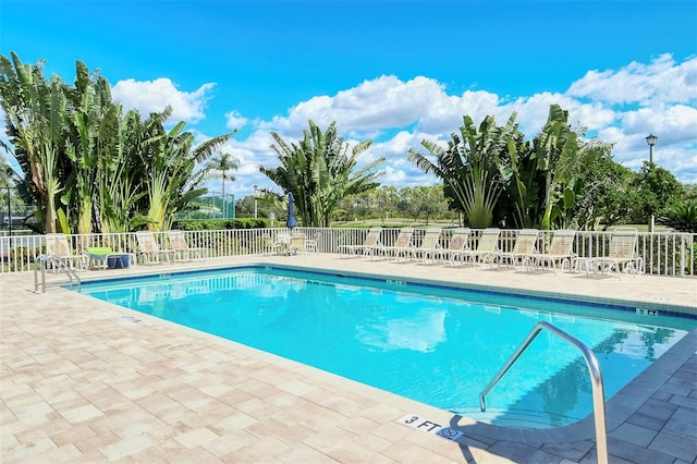 view of swimming pool featuring a patio area