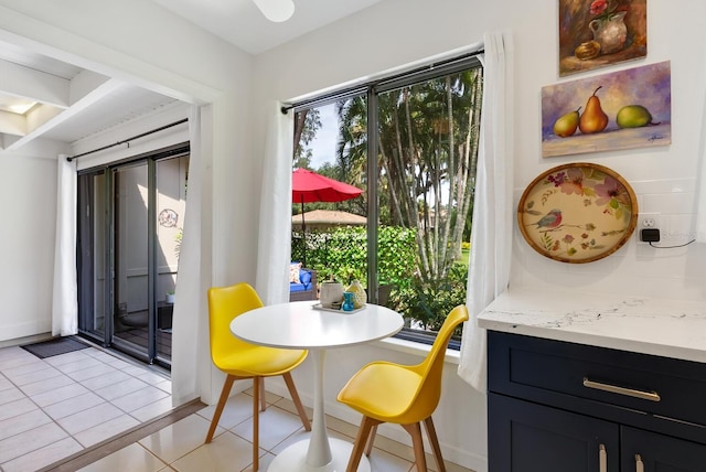 dining space with light tile patterned flooring