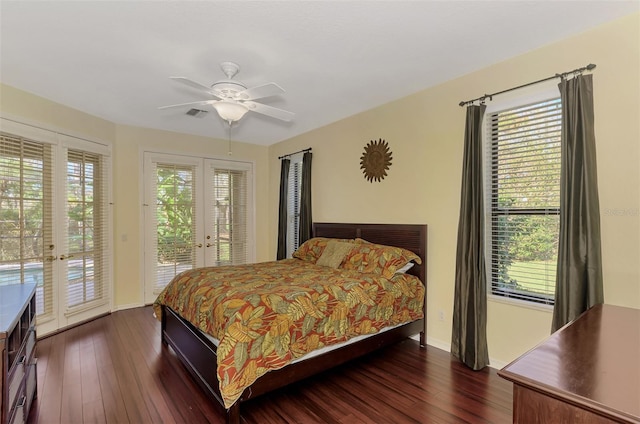 bedroom with french doors, multiple windows, and access to exterior