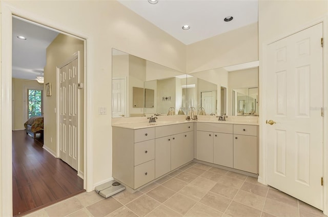 bathroom featuring vanity, ceiling fan, and hardwood / wood-style flooring