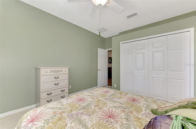 carpeted bedroom with a closet and ceiling fan