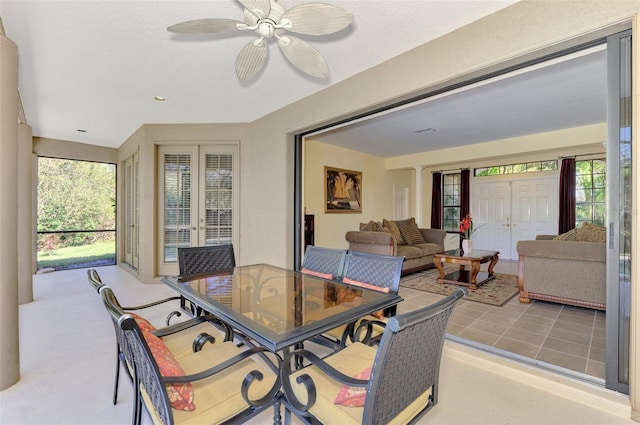 sunroom featuring a wealth of natural light and ceiling fan