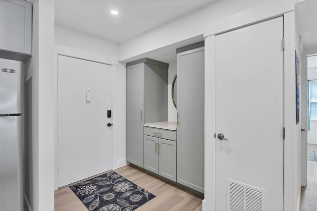 foyer with light hardwood / wood-style flooring