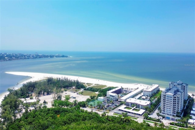 bird's eye view featuring a water view and a beach view