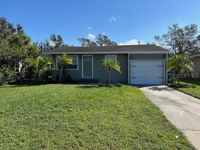 single story home featuring a front yard and a garage