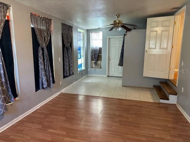 entrance foyer with light wood-type flooring and ceiling fan