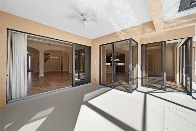 view of patio featuring ceiling fan