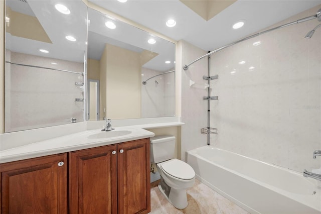 full bathroom with tile patterned flooring, vanity, tiled shower / bath combo, and toilet