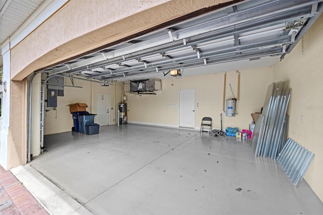 garage with electric panel, a garage door opener, and gas water heater