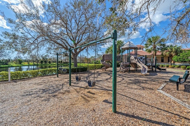 view of jungle gym with a water view