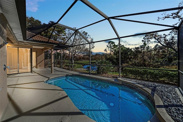 pool featuring a lanai and a patio