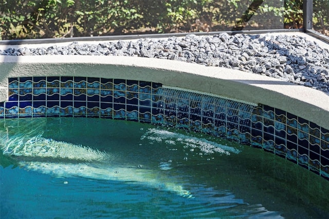 exterior details featuring a pool
