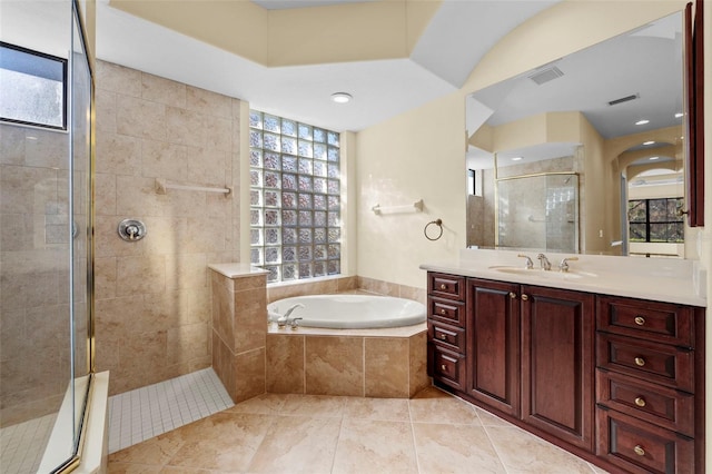full bathroom with tile patterned flooring, vanity, a shower stall, visible vents, and a garden tub