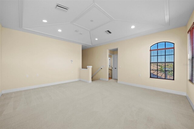 spare room featuring recessed lighting, baseboards, visible vents, and light carpet