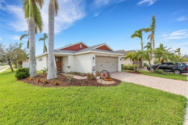 single story home featuring a front yard and a garage