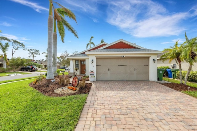 view of front of home with a garage and a front lawn