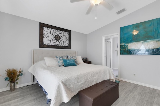 bedroom with light hardwood / wood-style flooring, lofted ceiling, and ceiling fan