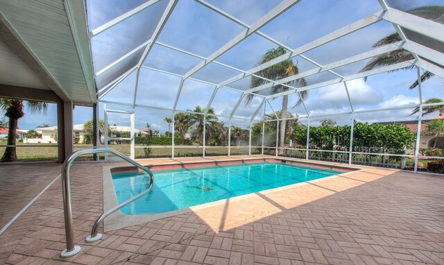 outdoor pool featuring a patio and a lanai