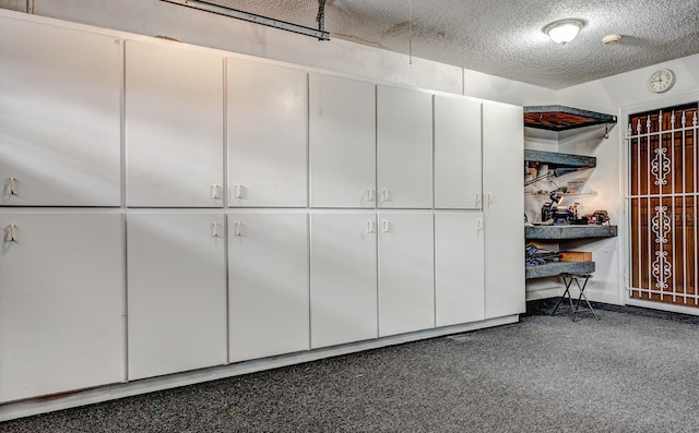 spacious closet featuring dark colored carpet