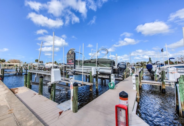 view of dock featuring a water view and boat lift