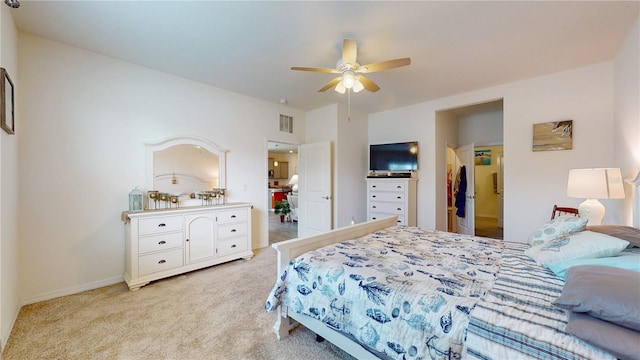 bedroom featuring ceiling fan and light carpet