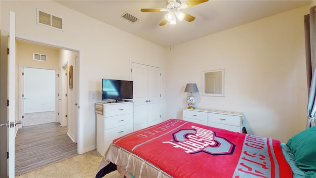 carpeted bedroom featuring ceiling fan