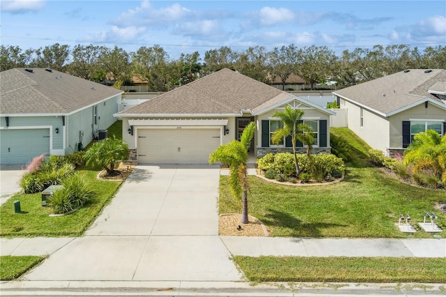 ranch-style home with a front yard and a garage