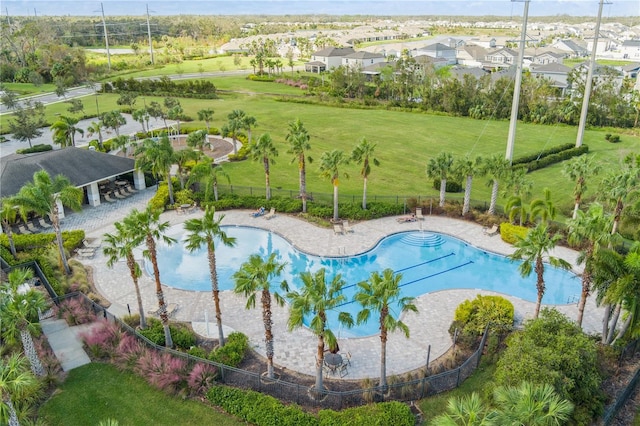 view of pool featuring a yard and a patio