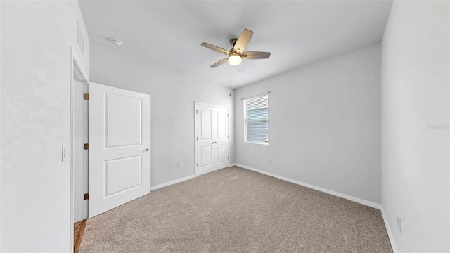 3718 Mossy Limb Ct, Palmetto, FL 34221 - unfurnished bedroom featuring carpet flooring, baseboards, a closet, and a ceiling fan