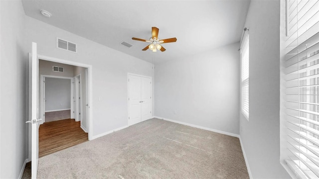 3718 Mossy Limb Ct, Palmetto, FL 34221 - unfurnished bedroom featuring carpet, baseboards, a ceiling fan, and a closet