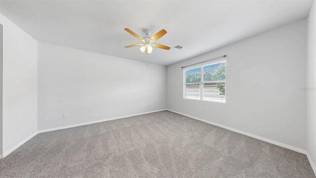 3718 Mossy Limb Ct, Palmetto, FL 34221 - carpeted empty room with baseboards and ceiling fan