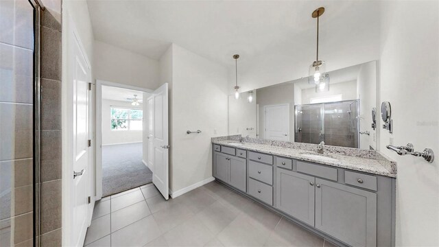 3718 Mossy Limb Ct, Palmetto, FL 34221 - full bathroom featuring double vanity, a stall shower, baseboards, and tile patterned flooring