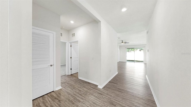 3718 Mossy Limb Ct, Palmetto, FL 34221 - corridor with wood finished floors, baseboards, and recessed lighting