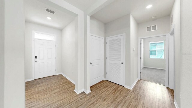 3718 Mossy Limb Ct, Palmetto, FL 34221 - entryway with light wood finished floors, baseboards, and recessed lighting