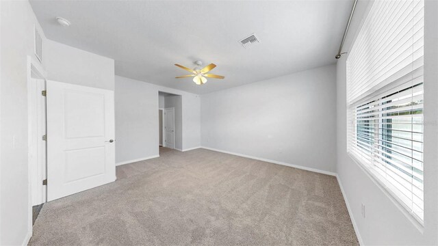 3718 Mossy Limb Ct, Palmetto, FL 34221 - unfurnished bedroom with carpet floors, baseboards, and ceiling fan