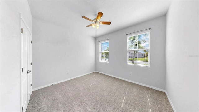 3718 Mossy Limb Ct, Palmetto, FL 34221 - carpeted spare room featuring a ceiling fan and baseboards