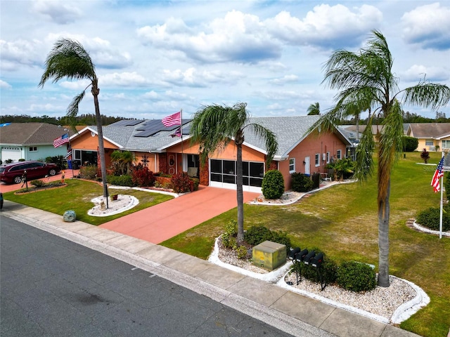 single story home with a front lawn