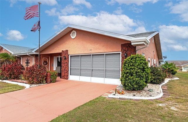 view of front of house with a front yard and a garage