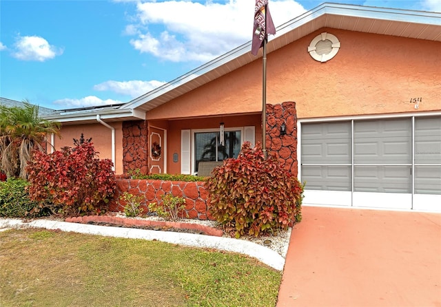 view of front facade with a front yard and a garage